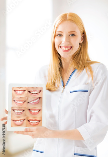 Photo: female doctor with tablet pc and smiles female doctor with tablet pc and smiles