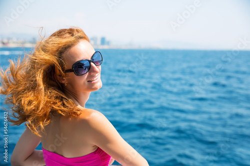 Photo: Young woman against sea Young woman against sea