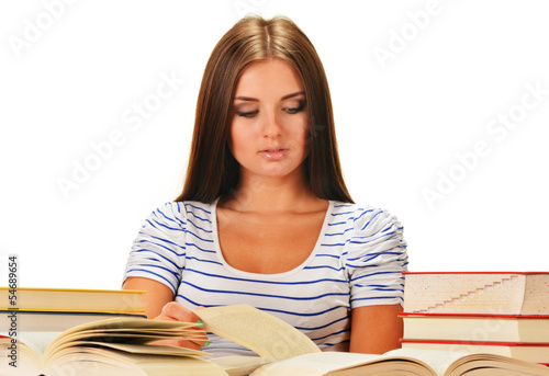 Photo: Young woman reading a book. Female student learning Young woman reading a book. Female student learning