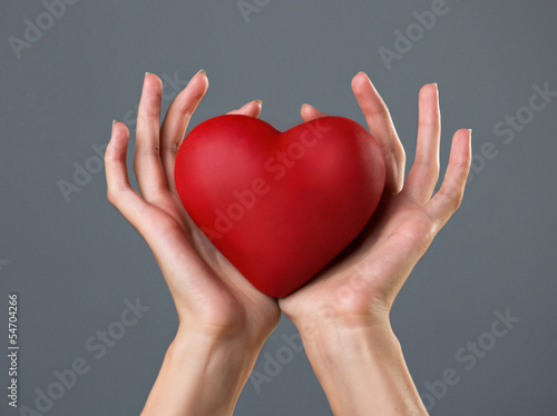 Photo: heart in woman`s palms heart in woman`s palms
