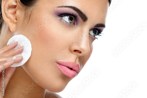 Photo: woman cleaning her skin woman cleaning her skin