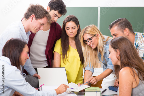 Photo: students looking at tablet pc students looking at tablet pc