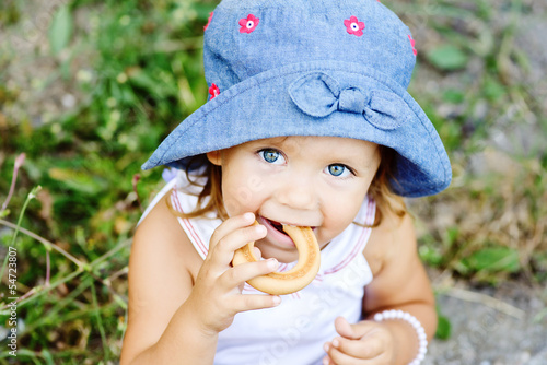 Photo: toddler girl eating cracknel toddler girl eating cracknel