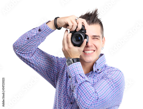Photo: Young man with camera. Isolated over white background Young man with camera. Isolated over white background