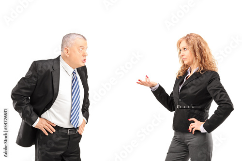 Photo: Mature man having a disagreement with a woman Mature man having a disagreement with a woman