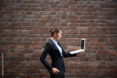 Photo: Businesswoman with laptop Businesswoman with laptop