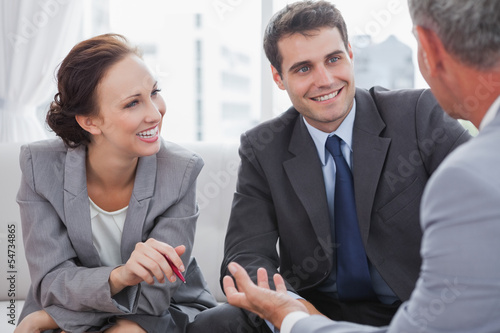 Photo: Businessman talking to his partners Businessman talking to his partners