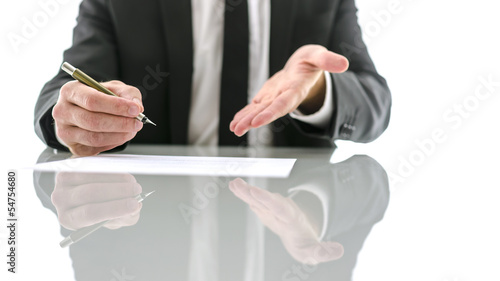 Photo: Businessman inviting you to sign a contract Businessman inviting you to sign a contract