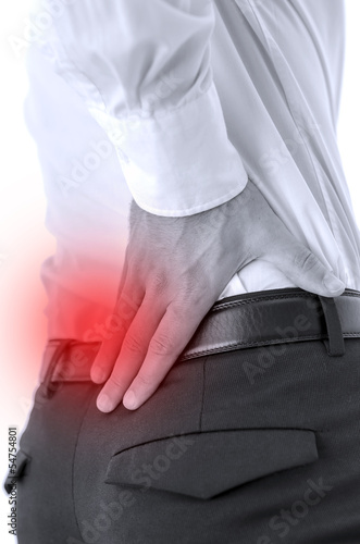 Photo: Closeup of lower back pain Closeup of lower back pain