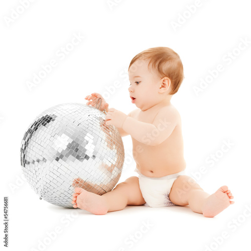 Photo: child playing with disco ball child playing with disco ball