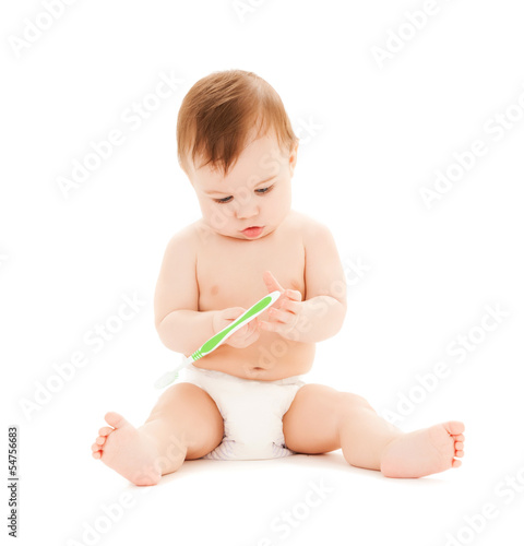 Photo: curious baby brushing teeth curious baby brushing teeth