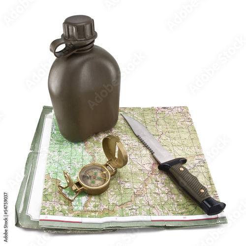 Photo: Army canteen, a knife and a compass are on the map Army canteen, a knife and a compass are on the map