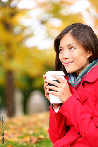 Photo: People drinking coffee - autumn woman in fall People drinking coffee - autumn woman in fall