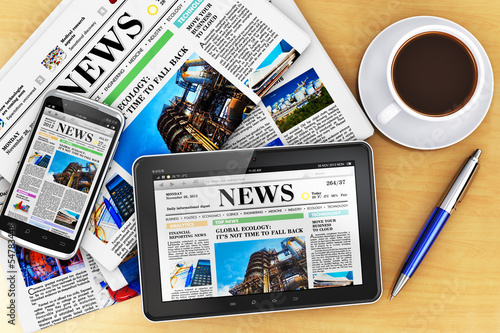 Photo: Tablet computer, smartphone and newspapers Tablet computer, smartphone and newspapers