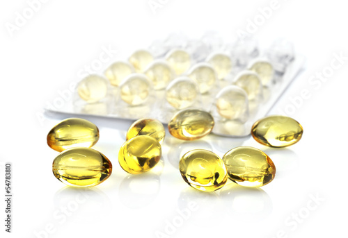 Photo: fish oil capsules and blister pack isolated on white background fish oil capsules and blister pack isolated on white background