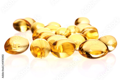 Photo: fish oil capsules isolated on white background fish oil capsules isolated on white background