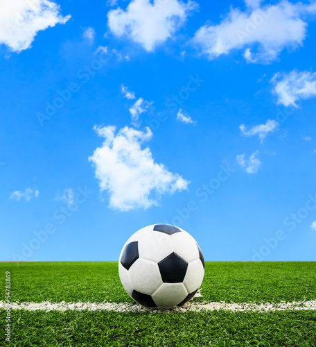 Photo: soccer ball on green grass field soccer ball on green grass field