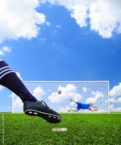 Photo: foot shooting soccer ball to goal, penalty foot shooting soccer ball to goal, penalty