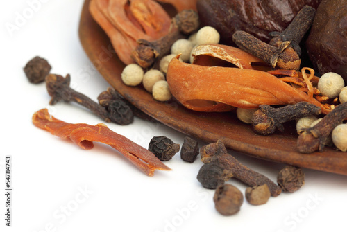 Photo: Indian spices over white background Indian spices over white background