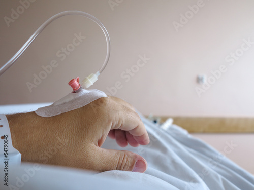 Photo: Patient's hand in the hospital with an IV Patient's hand in the hospital with an IV