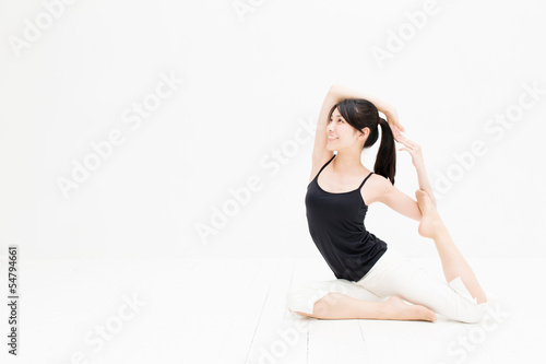 Photo: attractive asian woman exercising on white background attractive asian woman exercising on white background