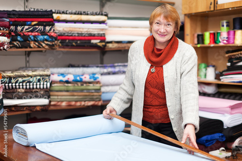 Photo: Salesclerk in the tissue store Salesclerk in the tissue store