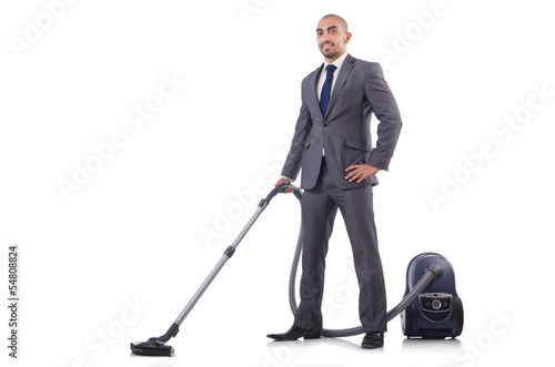 Photo: Businessman doing vacuum cleaning on white Businessman doing vacuum cleaning on white