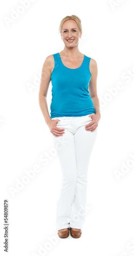 Photo: Woman in sleeveless top posing in style Woman in sleeveless top posing in style