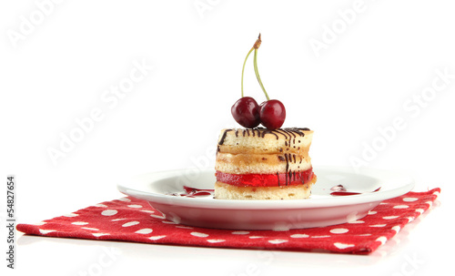 Photo: Tasty biscuit cake on plate isolated on white Tasty biscuit cake on plate isolated on white