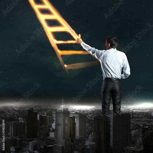 Photo: Businessman drawing ladder Businessman drawing ladder