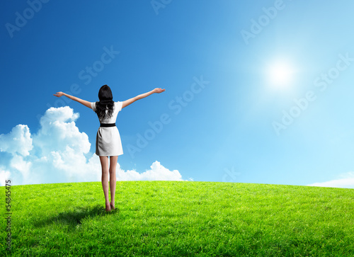 Photo: field of grass and happy young woman field of grass and happy young woman