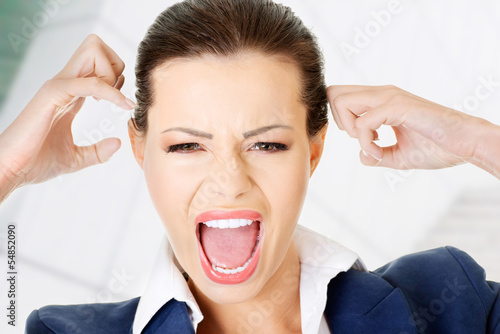 Photo: Stressed or angry businesswoman screaming Stressed or angry businesswoman screaming