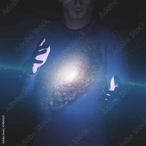 Photo: Man holds galaxy between his hands Man holds galaxy between his hands