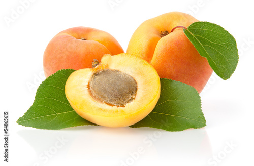 Photo: Ripe Apricots with Leaves Isolated on White Background Ripe Apricots with Leaves Isolated on White Background