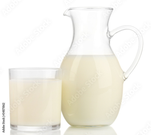 Photo: Milk in jug and glass isolated on white Milk in jug and glass isolated on white