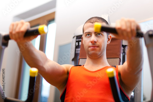 Photo: Man working out at the gym Man working out at the gym