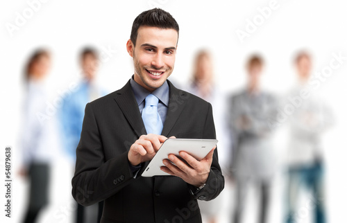 Photo: Businessman using his tablet Businessman using his tablet