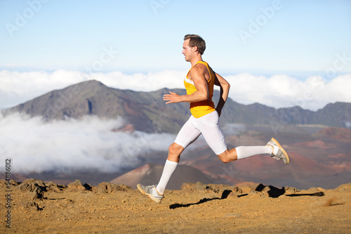 Photo: Runner man athlete running sprinting fast Runner man athlete running sprinting fast