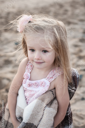Photo: Silhouette of adorable little girl on a beach at sunset Silhouette of adorable little girl on a beach at sunset
