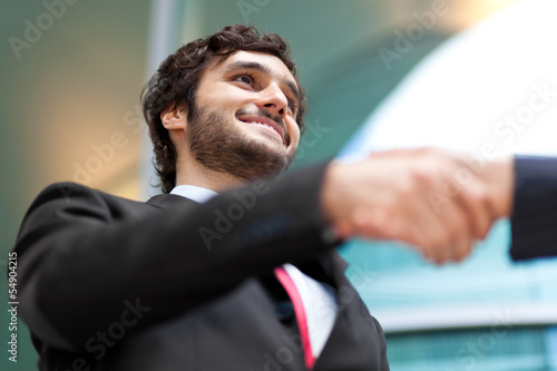Photo: Business people shaking hands Business people shaking hands