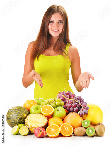 Photo: Young woman with assorted fruits isolated on white Young woman with assorted fruits isolated on white