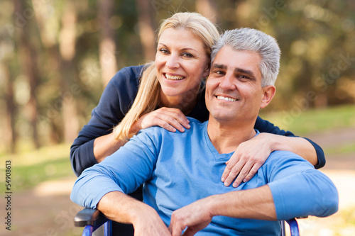 Photo: loving wife and disabled husband outdoors loving wife and disabled husband outdoors