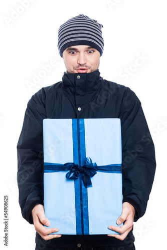 Photo: Surprised man with big present Surprised man with big present