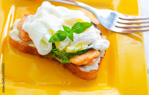 Photo: Close Up of Poached Delicious Egg with Whole Grain Bread Close Up of Poached Delicious Egg with Whole Grain Bread