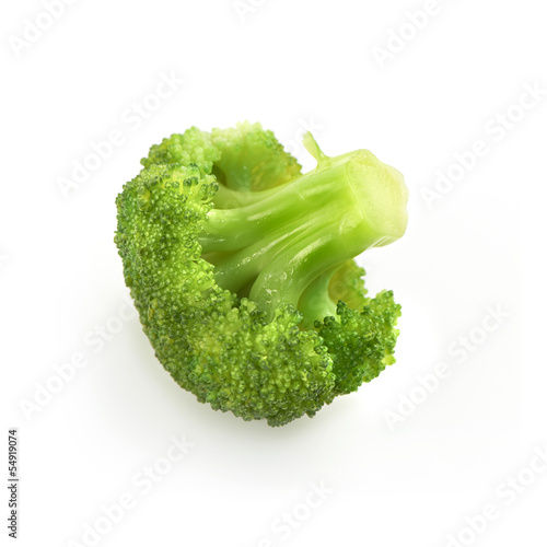 Photo: single piece of broccoli isolated on a white backround with shad single piece of broccoli isolated on a white backround with shad