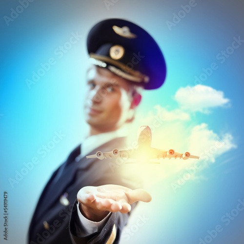 Photo: Image of pilot with plane in hand Image of pilot with plane in hand