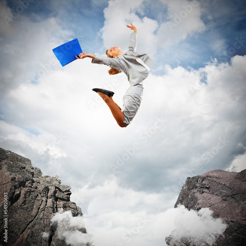 Photo: Young businesswoman jumping Young businesswoman jumping