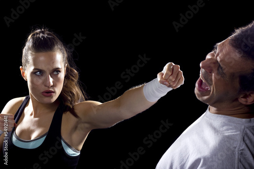 Photo: female MMA fighter fighting a man female MMA fighter fighting a man