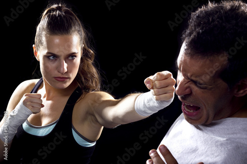 Photo: female MMA fighter fighting a man female MMA fighter fighting a man