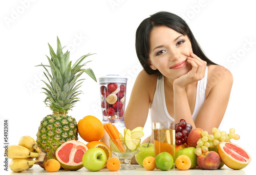 Photo: Girl with fresh fruits isolated on white Girl with fresh fruits isolated on white